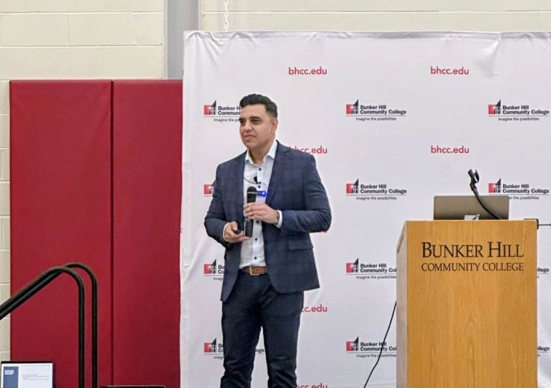 Adam Khan mentoring cybersecurity students at Bunker Hill Community College